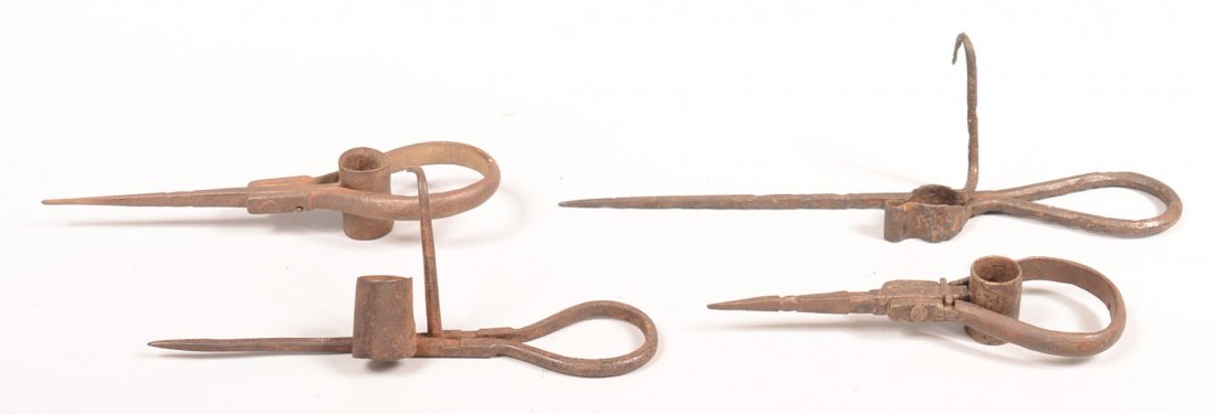 217. Four Iron Sticking Tommy Miner's lamps. Two with: 217. Four Iron Sticking Tommy Miner's lamps. Two with folding loop handles, 7"-11-1/2"l.Condition:Good with use wear.