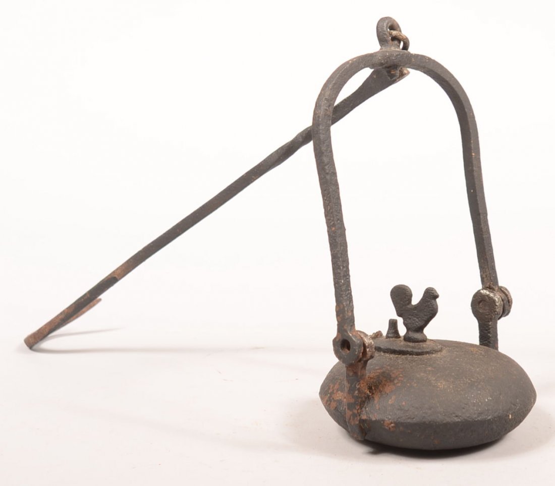 230. Iron Suspended Miner's Lamp. Painted black having: 230. Iron Suspended Miner's Lamp. Painted black having circular font with rooster finial, swing handle with hanging hook, 21-1/4"h. overall, Condition: Missing rivet at handle.