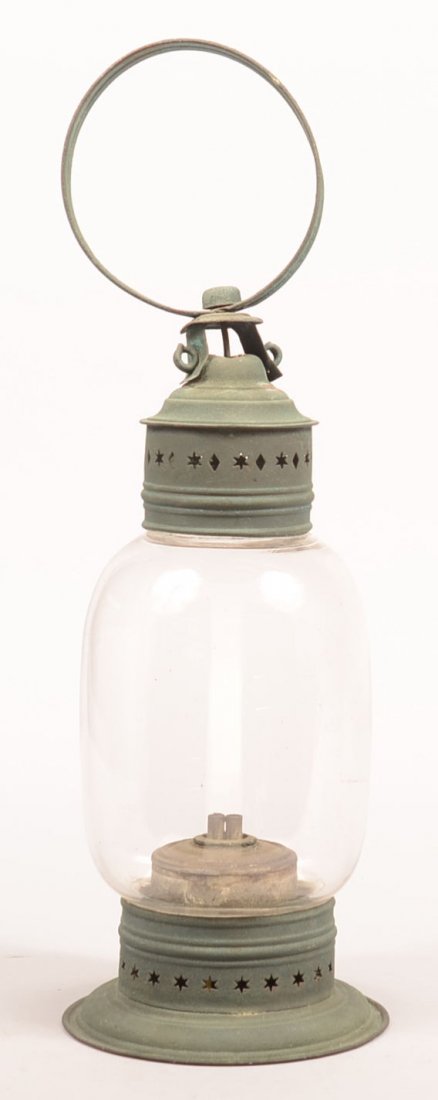 240. 19th Century Painted Green Tin Lantern with star: 240. 19th Century Painted Green Tin Lantern with star and diamond pierced dome top with ring handle, fixed ovoid colorless globe with original whale oil font and burner, star pierced base, 17"h. Condi