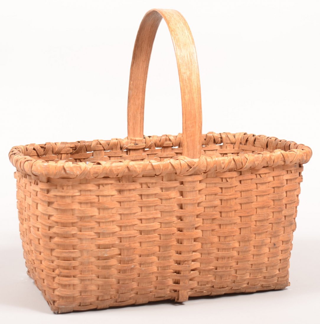 256. Woven Split White Oak Market Basket. Rectangular: 256. Woven Split White Oak Market Basket. Rectangular form with bentwood handle, 15-1/4"h.x16- 1/4"l.x11".Condition: Good with minor breaks.