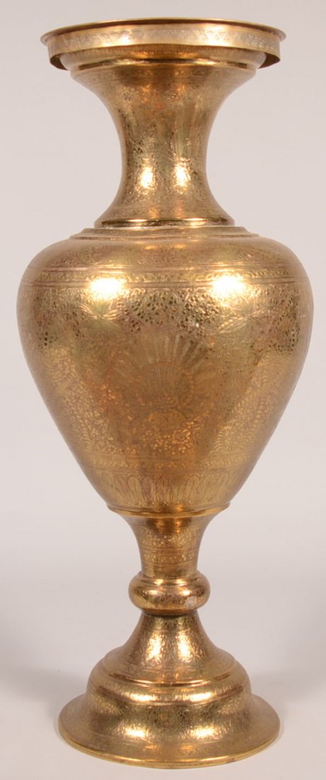 367. Elaborately Incised Brass Floor Vase with Incense: 367. Elaborately Incised Brass Floor Vase with Incense Burner Insert. Marked Made in India, circa. 1950. Fully decorated with peacocks, floral motifs, scrolls and symbols. 32" high. Condition: Very go