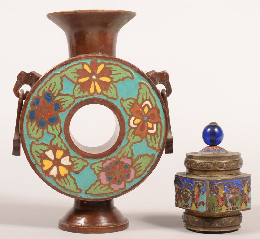 385. Two Oriental Champlevé Decorated Brass Vessels.: 385. Two Oriental Champlevé Decorated Brass Vessels. Doughnut vase with drop tassel, 8-1/2"h. and a small tea caddy with figural decoration, marked "CHINA", 4"h. Condition: Good with minor wear.