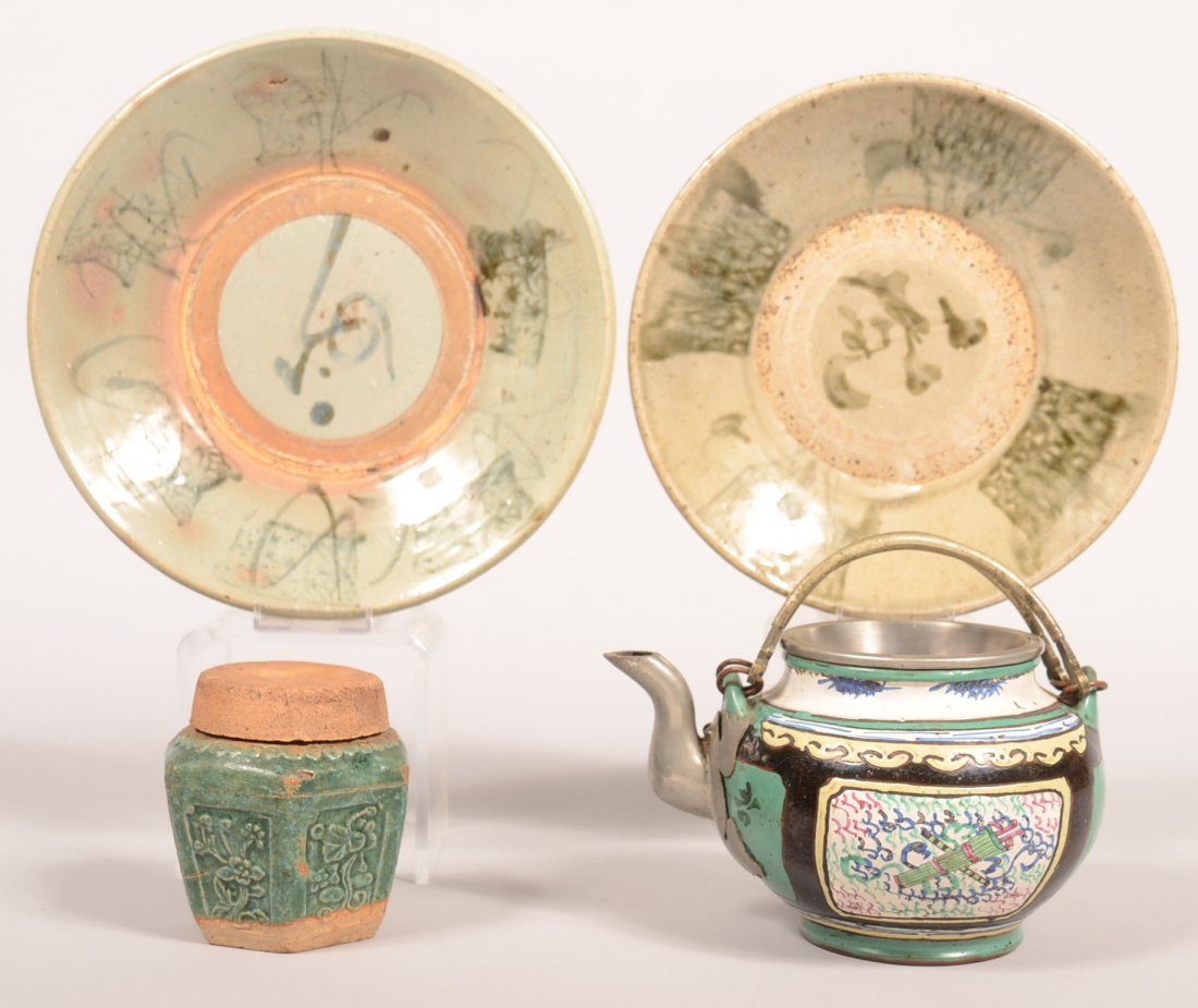 393. Four Pieces of Oriental Porcelain; Tin glazed: 393. Four Pieces of Oriental Porcelain; Tin glazed earthenware teapot with pewter spout with frog mounting, 5"h., two green glazed pottery plates, 9" and 9-3/4" diam. And a blue/green glazed spice jar