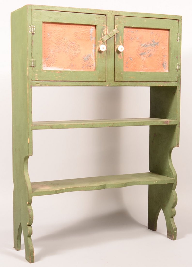 434. Green painted softwood Child's Size Bucket Bench.: 434. Green painted softwood Child's Size Bucket Bench. Having Two orange painted punched tin panel doors with peacock motif, two open lower shelves with great cut-out legs and high arched cut-out feet