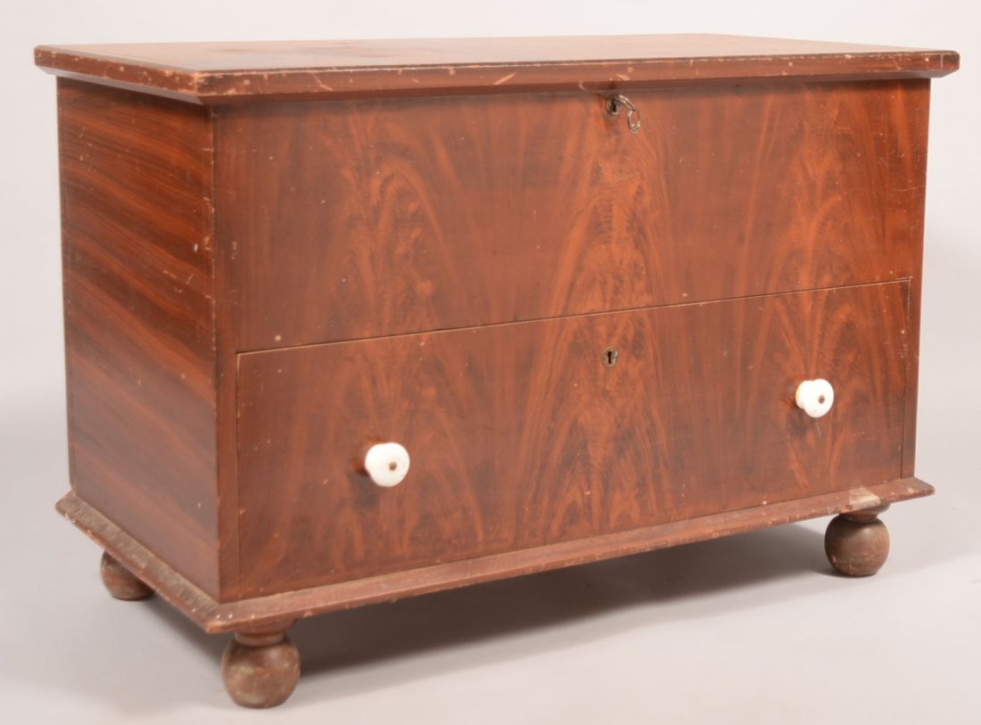 436. Pennsylvania 19th Century Softwood Grain Paint: 436. Pennsylvania 19th Century Softwood Grain Paint Decorated Blanket Chest. Molded lid, dovetailed case, full width deep dovetailed drawer, molded base and turned onion feet. 25-1/2"h x 38"w x 19"d. 