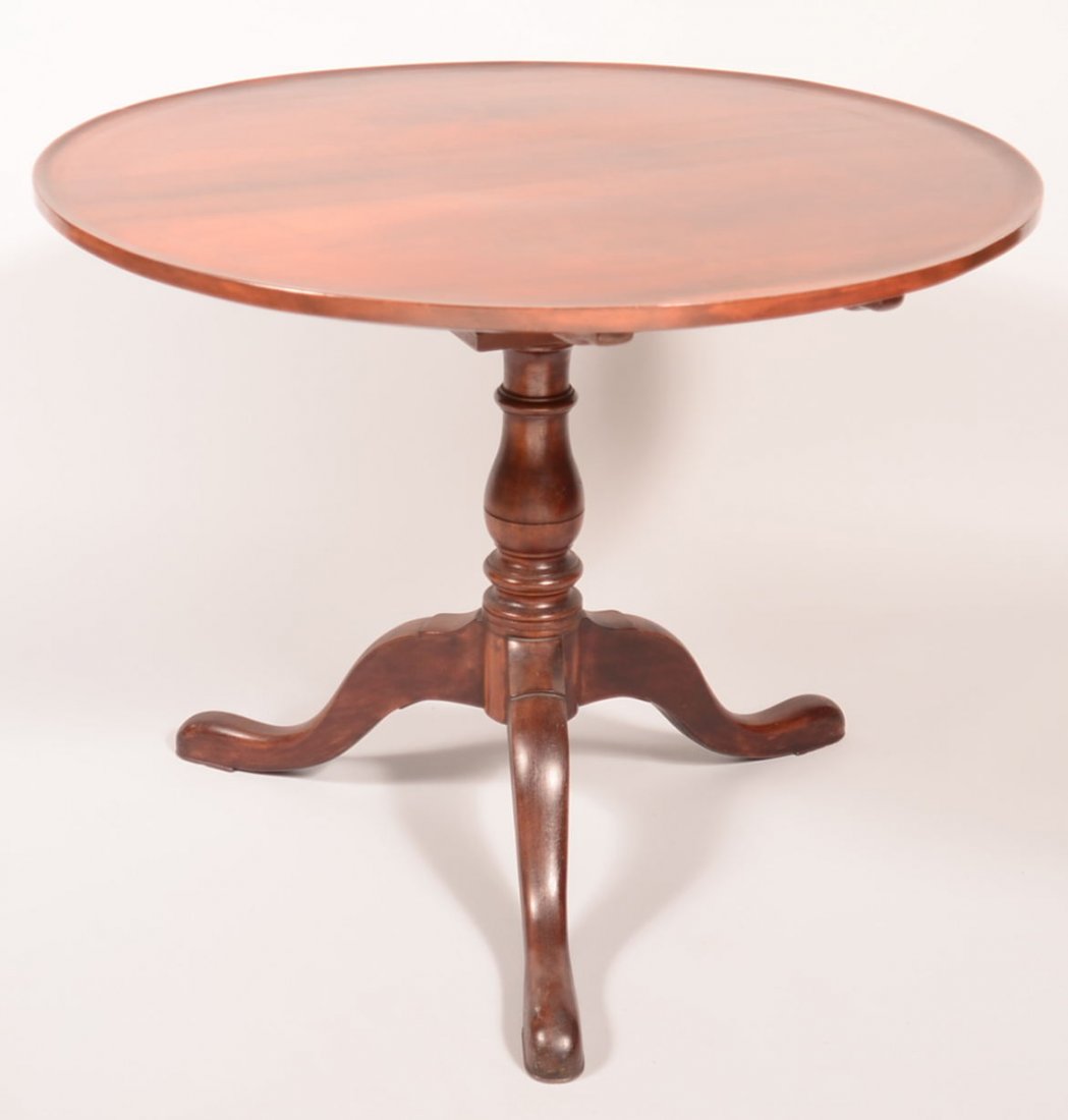 468. Queen Anne Centennial Walnut Tilt-top Tea Table.: 468. Queen Anne Centennial Walnut Tilt-top Tea Table. Circular top with bird cage support, turned pedestal base with cabriole legs and pad feet. 28"h x 35-1/4" diam. Condition: Very good.