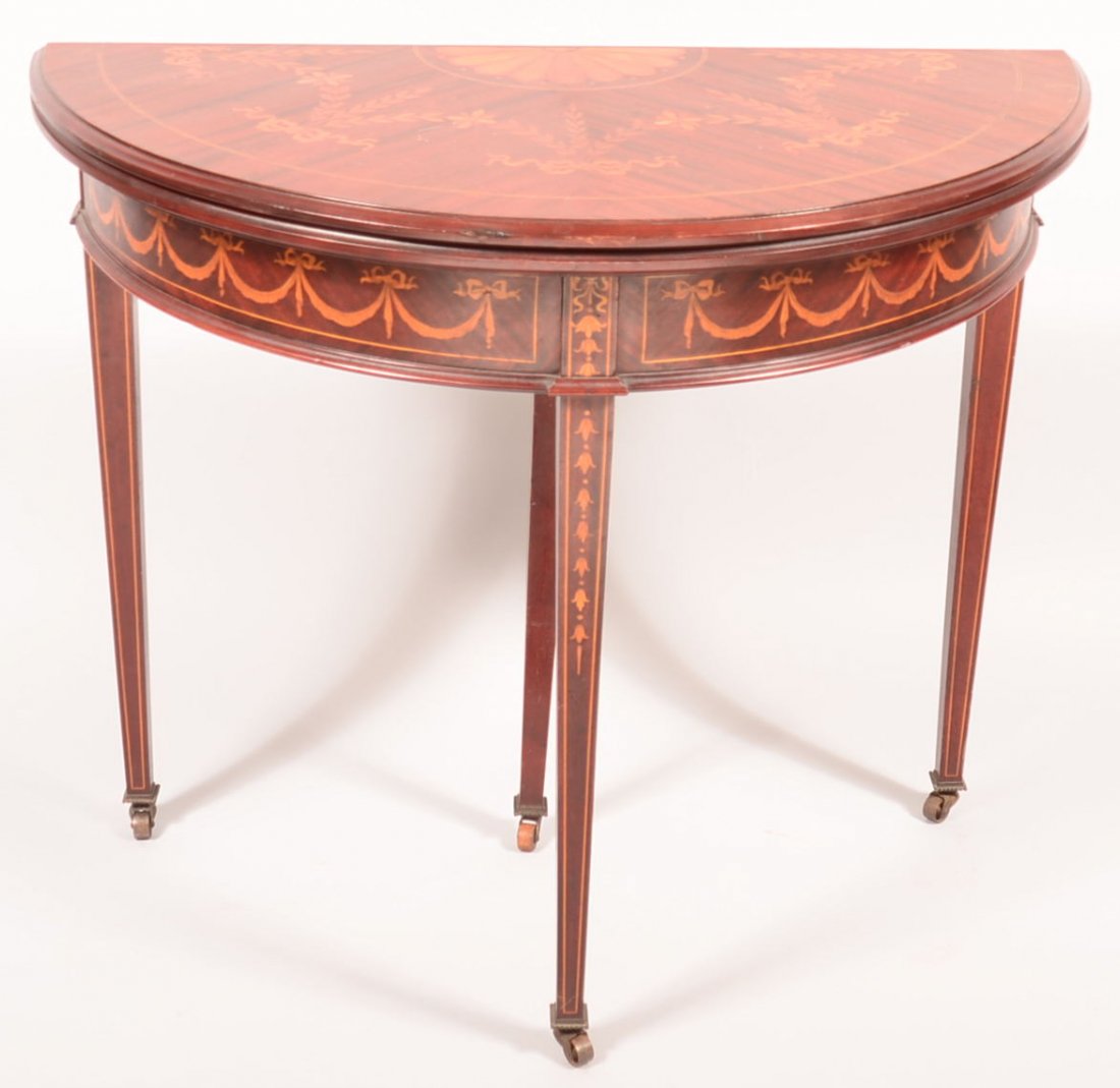 476. Baltimore Hepplewhite Style Mahogany Inlaid Game: 476. Baltimore Hepplewhite Style Mahogany Inlaid Game Table. Profusely inlaid with shell, ribbon and floral swags and drapes on top and skirt, bellflower and line inlay on tapered legs. 30"h x 36"w. C