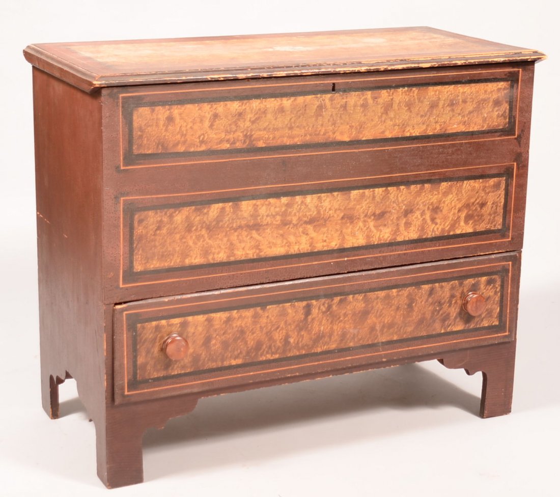 486. Mid 19th Century New England Softwood Paint: 486. Mid 19th Century New England Softwood Paint Decorated Blanket Chest. Molded lid with full width dovetailed lower drawer and shaped cut-out feet. 32-1/2"h x 39-1/2"w x 18-1/2"d. Condition: Good wi