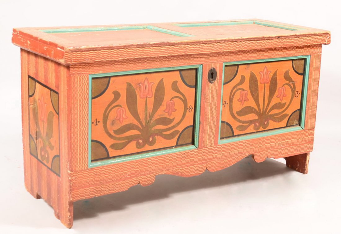 497. Softwood Blanket Chest Dated 1873. Grain painted: 497. Softwood Blanket Chest Dated 1873. Grain painted with tulip decoration. Double paneled lid and front with scalloped cut-out skirt. Interior with wrought iron strap hinges and jaw lock. 29-1/2"h x
