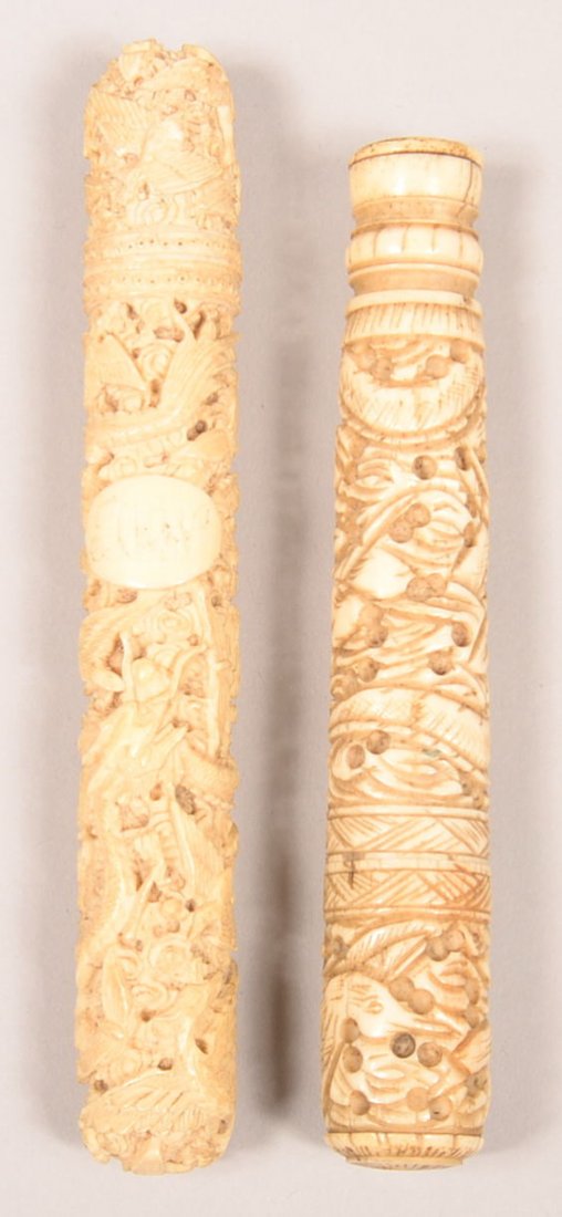 500. Two Carved Bone/Ivory Needle Cases with ornate: 500. Two Carved Bone/Ivory Needle Cases with ornate dragon, bird and foliate designs, with contents. Late 19th/early 20th century. 5-1/2" and 6" long. Condition: Good with some age cracks.
