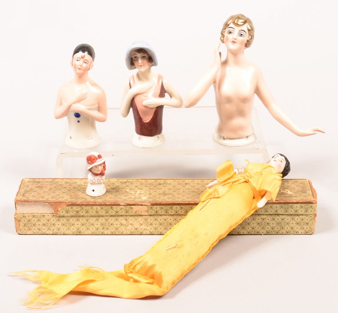 505. Lot of Five German Hand Painted China Pin Cushion: 505. Lot of Five German Hand Painted China Pin Cushion Dolls, Circa. 1920's. One in the original box, complete, other four china tops only. Tallest 4-5/8" high. Condition: Good.