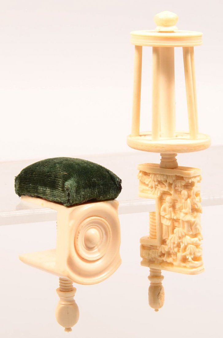 511. Two Bone and Ivory Screw Clamp Sewing Items; Spool: 511. Two Bone and Ivory Screw Clamp Sewing Items; Spool winder with carved Japanese figural scene, 4-1/2"h. and a pin cushion with bulls eye rosette.2-3/4"h. Condition: Very good.