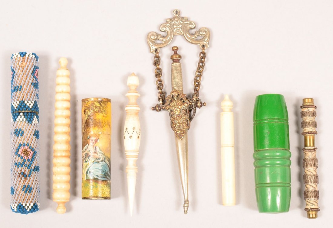 512. Seven Various Needle Cases and a Dagger form: 512. Seven Various Needle Cases and a Dagger form Sewing Scissors. Ivory, bone painted celluloid, beadwork, and bake-a-lite. 2-1/2" to 3-1/4" long. Condition: Very good.
