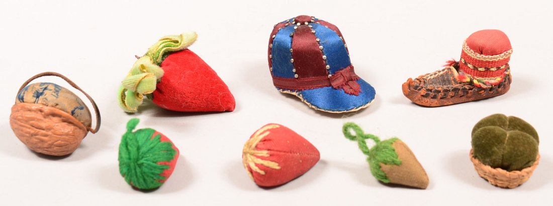 513. Eight Various Form Vintage Pin Cushions. Hat,: 513. Eight Various Form Vintage Pin Cushions. Hat, shoe, strawberry, and basket forms. Largest measures 2-1/4" long. Condition: Very good.