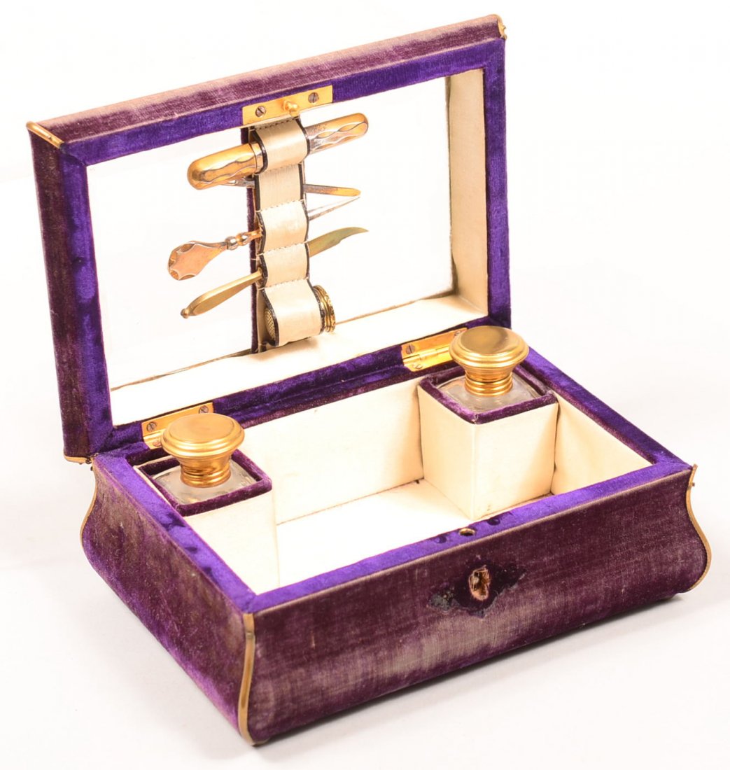 517. 19th Century Purple Velvet Covered Sewing Box with: 517. 19th Century Purple Velvet Covered Sewing Box with interior accessories. 3"h x 7"w x 4-3/4"d. Condition: Good with wear on velvet.