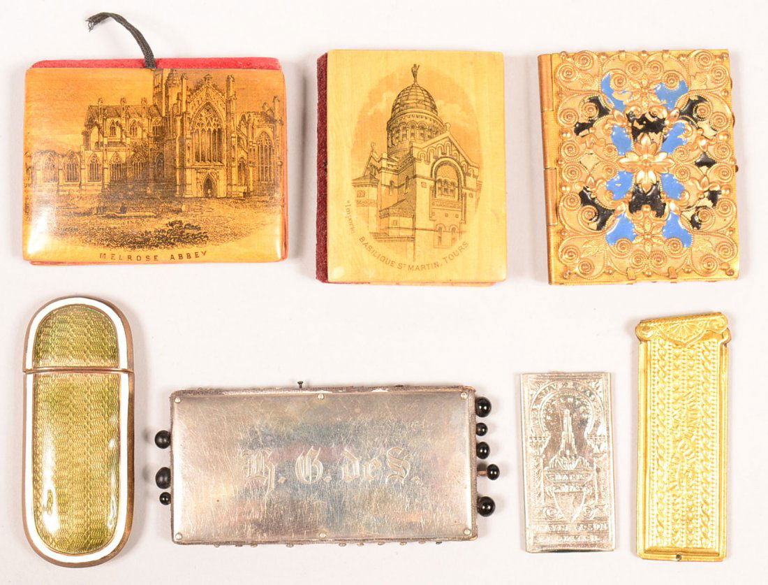 520. Seven Various Antique and Vintage Needle Cases.: 520. Seven Various Antique and Vintage Needle Cases. Two wood transfers, "Melrose Abbey" and "Basilque St. Martin", sterling case, two metal cased and two enamel cased. Condition: good with use wear.