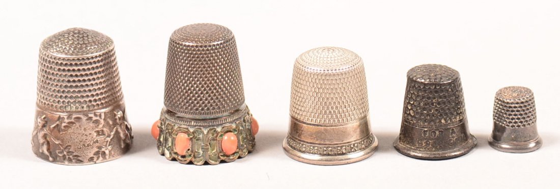 524. Four Various Antique Sterling Silver Thimbles and: 524. Four Various Antique Sterling Silver Thimbles and a cast metal "For a good girl thimble. Some with gold flashing and chased decoration. Condition: good with use wear.