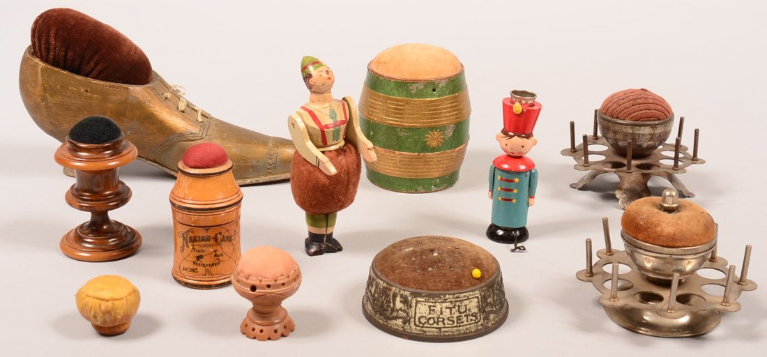 536. Lot of Vintage Pin Cushions and Spool Holders. 1": 536. Lot of Vintage Pin Cushions and Spool Holders. 1" to 7" long. Condition: Good with wear.