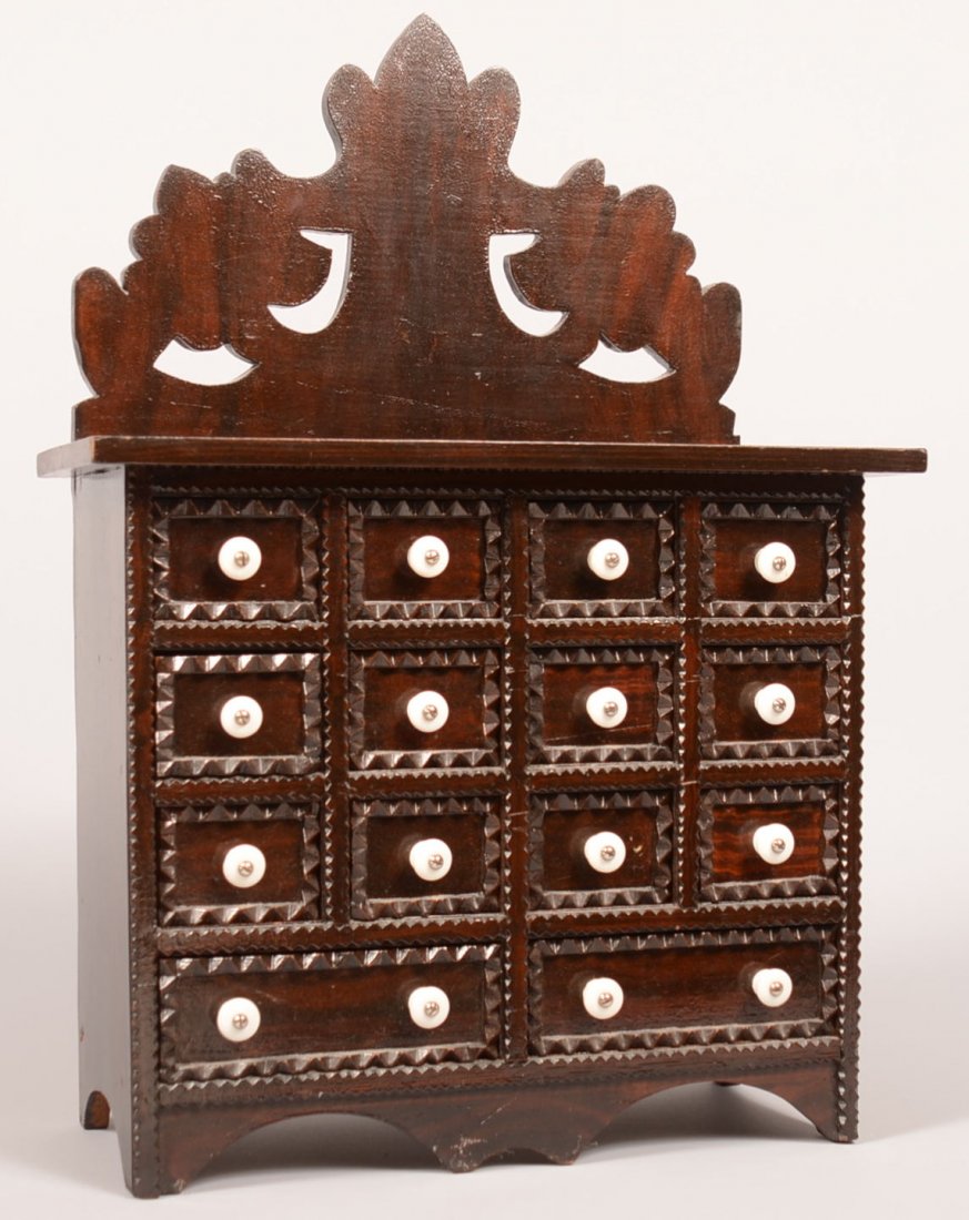 542. Pennsylvania 19th Century Tramp Art Seed Chest: 542. Pennsylvania 19th Century Tramp Art Seed Chest with original varnished surface. Pierce and shape crest above 14 chip carved drawers and scalloped base. Signed on back in pencil "Made by Great Gra