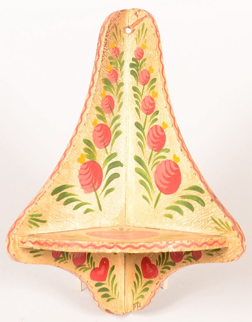 565. Polychrome Decorated Wood Hanging Corner Shelf: 565. Polychrome Decorated Wood Hanging Corner Shelf Signed "P.H." (Peter Hunt, circa. 1940). Ivory ground with bold stylized floral, heart and foliate decoration. 13" high. Condition: Very good with u