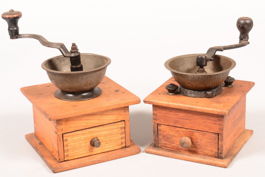 576. Two Late 19th/Early 20th Century Oak Coffee: 576. Two Late 19th/Early 20th Century Oak Coffee Grinders. Tin mounted hoppers with finger jointed cases. 8" and 9" high. Condition: Good with use wear.