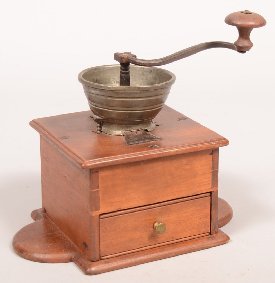 582. Pennsylvania 19th Century Cherry Coffee Grinder.: 582. Pennsylvania 19th Century Cherry Coffee Grinder. Pewter hopper and dovetailed case. Iron crank handle signed "D.W.". 10" high. Condition: Good with use wear, replaced screws on hopper.