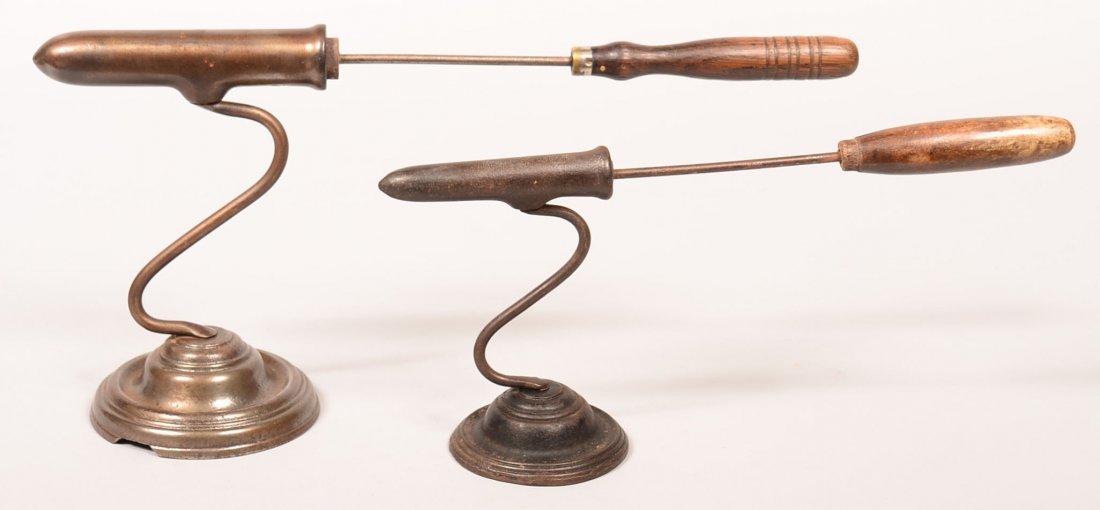 629. Two 19th Century Goffering Irons with cast iron: 629. Two 19th Century Goffering Irons with cast iron bases, Larger one signed Kenrick, 6" and 7-1/2"h. Condition: Good with use wear and larger one with break to base.