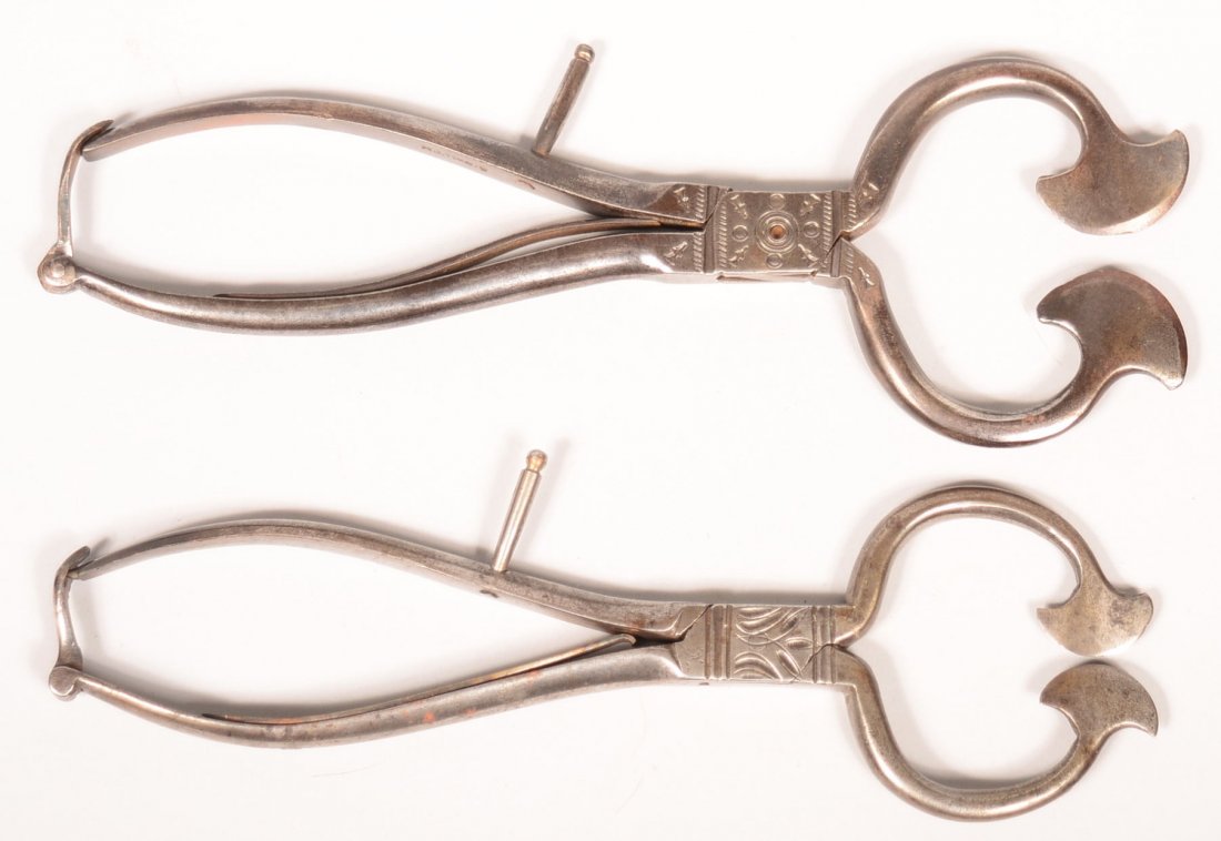 633.Two Steel Sugar Cutters. One Signed B. Smith,: 633.Two Steel Sugar Cutters. One Signed B. Smith, Decorative tool work on throat, Spring-action handle with closure latch, Shaped cutting terminals, 9-1/2"l.and 9-1/4"l. Condition: Good with use wear.