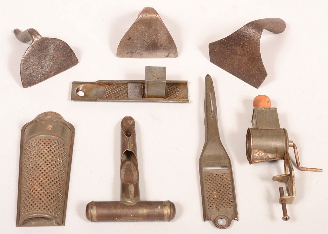 635. Grouping of Kitchen Wares. Including Wrought Iron: 635. Grouping of Kitchen Wares. Including Wrought Iron Dough Scrapers with rounded handles,2" -2-3/4"h., Tin Nutmeg Graters 5-3/4"l.-8-3/4"l. and a Corer marked Fries, 6"l. Condition: Good with use we