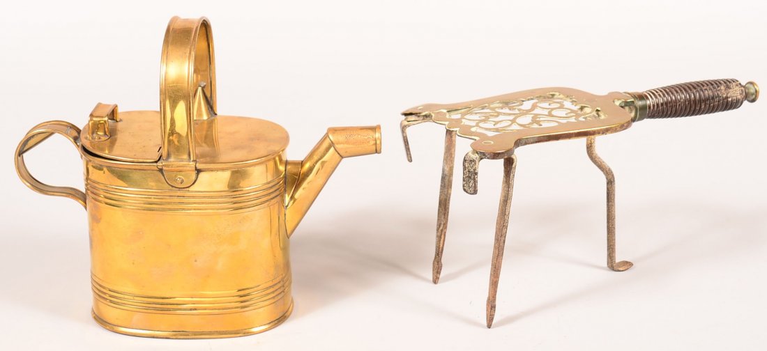 642. Brass Watering Can and Brass Trivet. Water can: 642. Brass Watering Can and Brass Trivet. Water can Oblong form with reed type decorated, hinged lid, applied handles, stylized goose neck spout, 9-1/4"h. Brass top trivet with open work decorations,