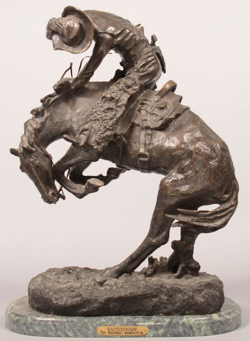 685. Fredric Remington Bronze Statue. on Marble Base: 685. Fredric Remington Bronze Statue. on Marble Base with brass plaque titled The Rattlesnake, 23"h. Condition: Very good.