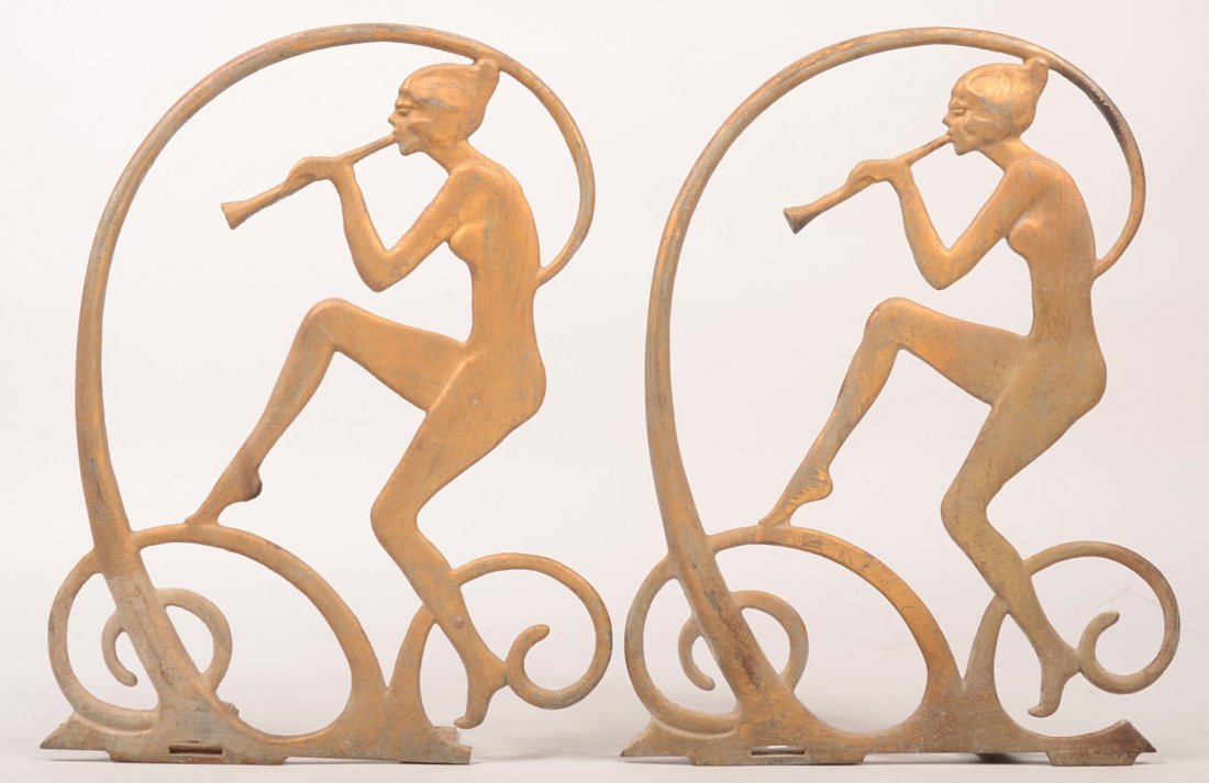 689. Pair of Art Deco Nude Shelf Supports. Metal full: 689. Pair of Art Deco Nude Shelf Supports. Metal full body nude playing musical instrument and scroll design with gilt finish, 16-1/4"h. Condition: Good with use wear.