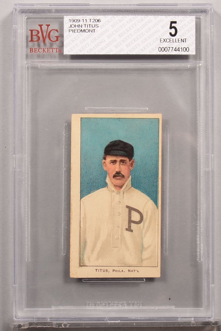 T-206 white border card circa 1909-1911. John Titus of: T-206 white border card circa 1909-1911. John Titus of Philadelphia with a Piedmont back. Condition: EX 5 in a Beckett graded holder. Front centered 85/15 left to right. Left border has thin line of p