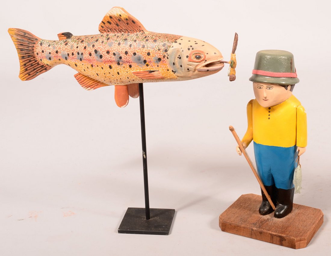 Fish Decoy and Fisherman Sculptures. Unsigned miles: Fish Decoy and Fisherman Sculptures. Unsigned miles trout fish decoy with metal stand, 13-1/2"l. carved and realistic painted, Phyllis Cosman fisherman with yellow shirt and blue trousers, carved and