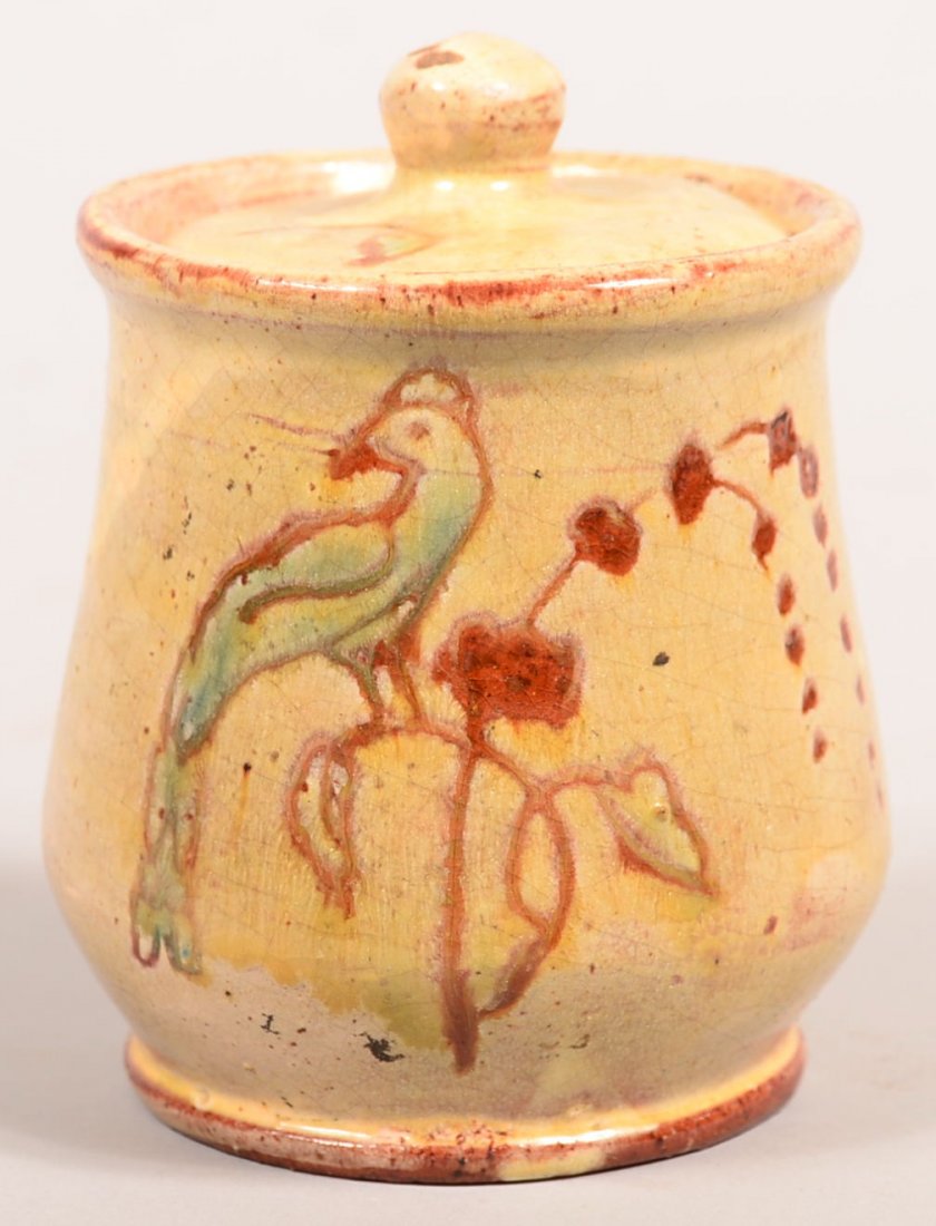 Gleaves Redware Covered Sugar Bowl. Slip and sgraffito: Gleaves Redware Covered Sugar Bowl. Slip and sgraffito decorated with perched bird on flower branch, incised on bottom Colonial Studio, 4-1/2"h.Condition: Good