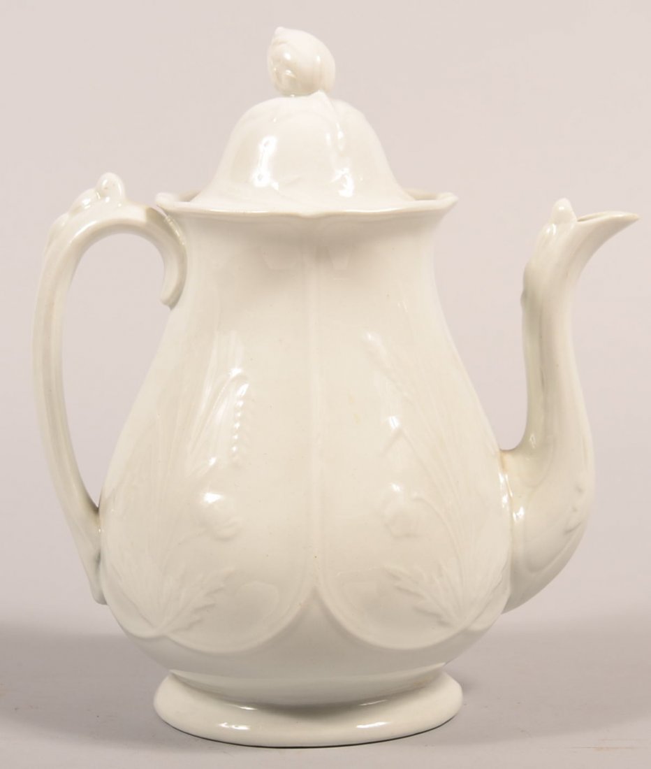 White Ironstone China "Prairie Shape" Coffee Pot by J.: White Ironstone China "Prairie Shape" Coffee Pot by J. Clementson. Four upside down arched panels with embossed gathering of poppies and wheat, 10-1/4"h. Condition: Good, no damage.
