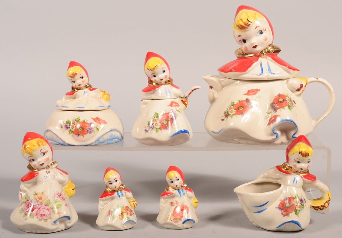 Seven Pieces of Hull Little Red Riding Hood China. Hand: Seven Pieces of Hull Little Red Riding Hood China. Hand painted with floral decal. Teapot, 8"h., covered sugar bowl, 4-1/2"h., cream pitcher, 5"h., covered mustard pot with the original spoon, 5-1/4"h