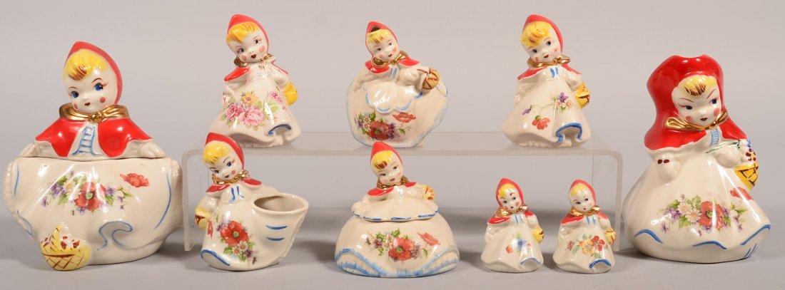 Nine Pieces of Hull Little Red Riding Hood China. Hand: Nine Pieces of Hull Little Red Riding Hood China. Hand painted with floral decal. Biscuit jar, 8-1/4"h., milk pitcher, 8"h., covered sugar bowl, 4-3/4"h., open sugar bowl, 5"h., head spout cream pitch