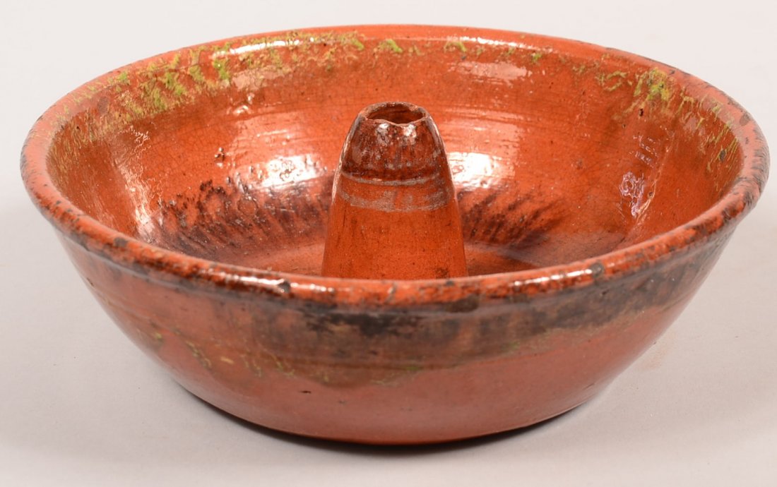 19th Century Glazed Redware Turks Mold with green and: 19th Century Glazed Redware Turks Mold with green and manganese alternating banding interior decorations, exterior with overlapping band around rim, 3"h. x 9"dia. Condition: Interior cone rim with chi