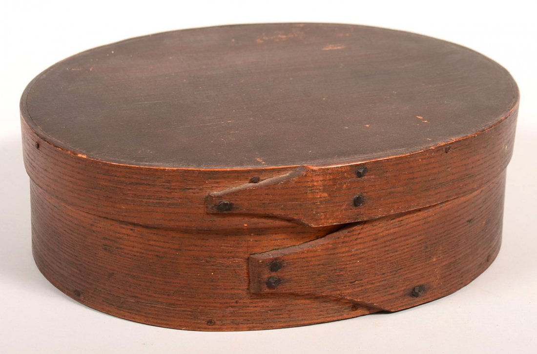 19th Century Oval Pantry Box having single lapped joint: 19th Century Oval Pantry Box having single lapped joint with rosette tacks, Oak and softwood, 4"h. x 11-/2"w. x 9"d. Condition: Very good.
