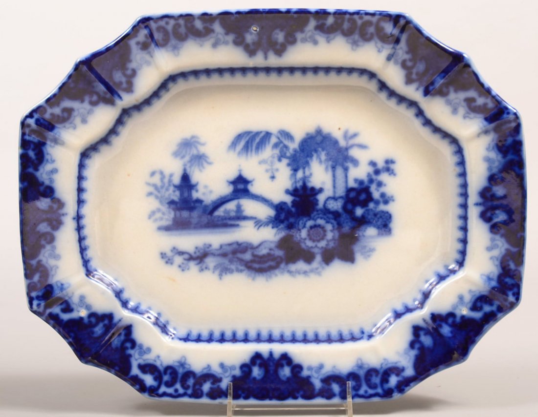 Flow Blue Ironstone Transfer China "Kaolin" Pattern: Flow Blue Ironstone Transfer China "Kaolin" Pattern 15-3/4" Platter impressed "PW & CO". Condition: Good with minor surface scratches.
