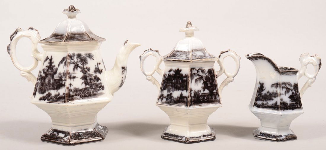 Mulberry Transfer Ironstone China "Corean" Pattern: Mulberry Transfer Ironstone China "Corean" Pattern Three Piece Tea Set. Paneled form with cock's comb handles. Teapot, 9-1/2"h., covered sugar bowl, 8-1/2"h. and cream pitcher, 6"h. Condition: Teapot