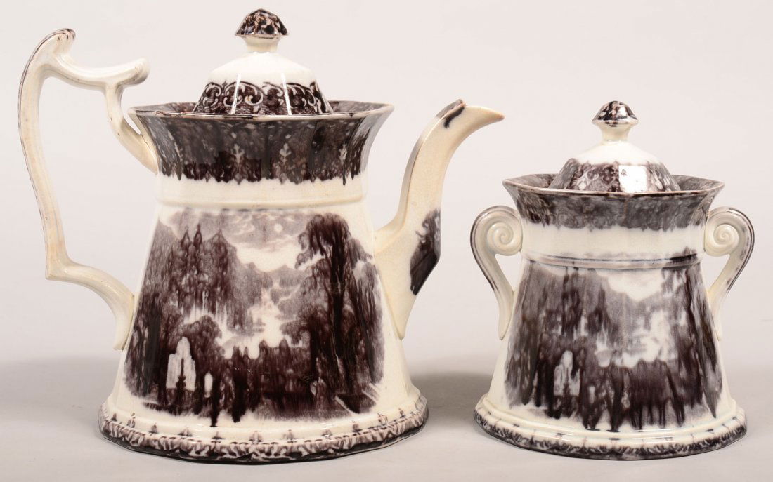 Two Pieces of Mulberry Transfer Ironstone "Peruvian": Two Pieces of Mulberry Transfer Ironstone "Peruvian" Pattern China by Wedgwood. Paneled teapot, 9-1/4"h. and covered sugar bowl, 7-1/4"h. Condition: Teapot has repaired spout, sugar bowl has repaired