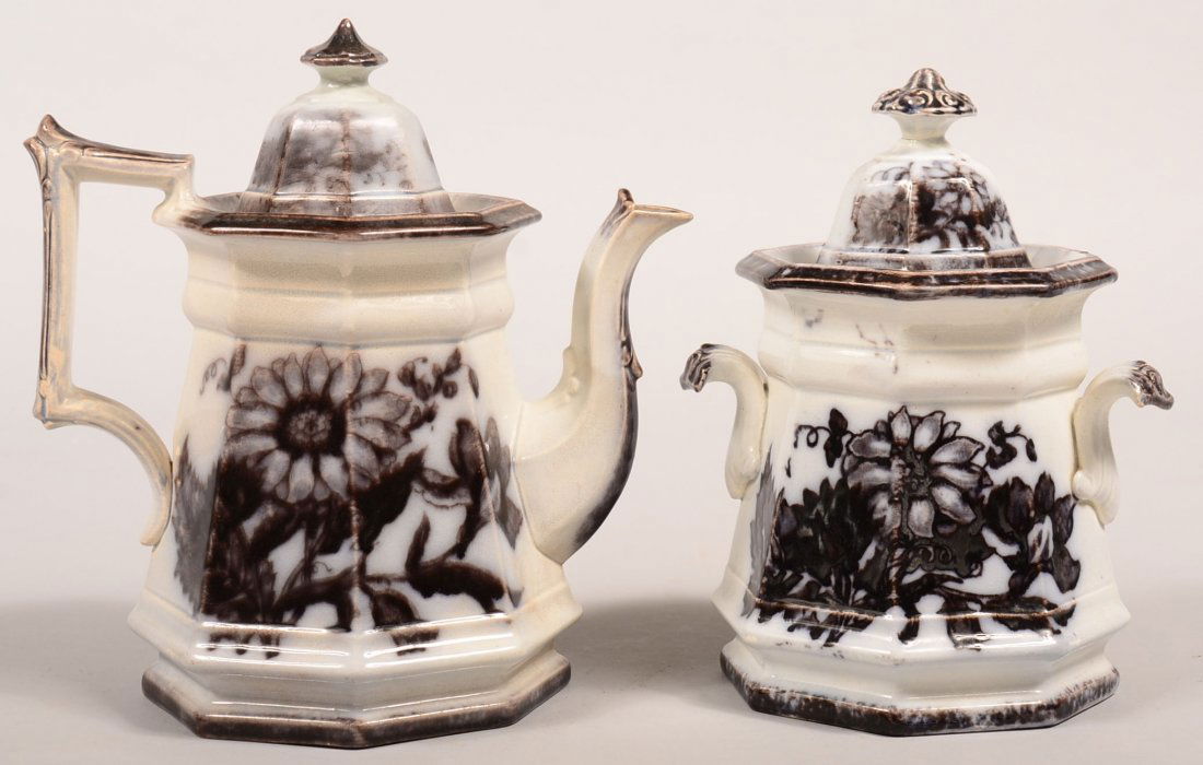 Two Pieces of Mulberry Transfer Ironstone "Flora": Two Pieces of Mulberry Transfer Ironstone "Flora" Pattern China by T. Walker. Paneled teapot, 9"h. and covered sugar bowl, 8-1/4"h. Condition: Both pieces have repaired finials on lids, bases are good