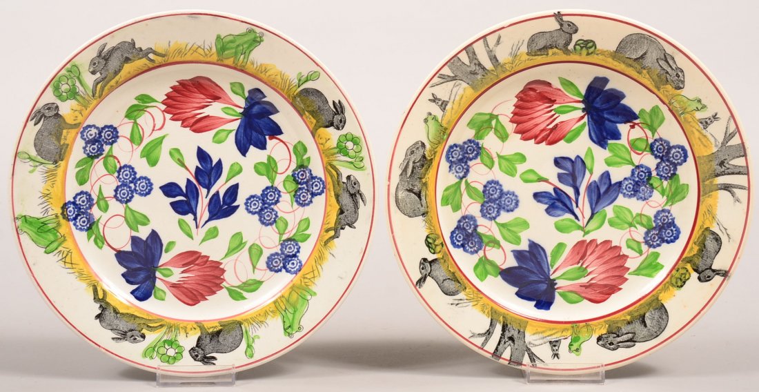 Two Rabbitware Stick Spatter Ironstone China Plates.: Two Rabbitware Stick Spatter Ironstone China Plates. Polychrome Virginia Rose stick spatter centers with rabbit and frog borders (note one plate has the tree variant border). Condition: Good, tree bor