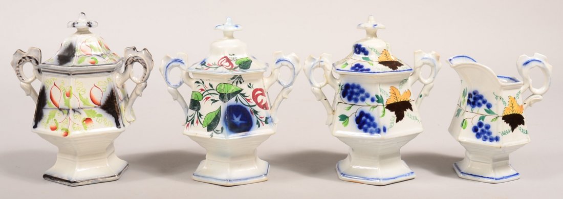 Four Pieces of Gaudy Ironstone China with Cock's Comb: Four Pieces of Gaudy Ironstone China with Cock's Comb Handles. Grape pattern cream and covered sugar, Strawberry pattern covered sugar and Morning Glory pattern covered sugar. Cream pitcher measures 6