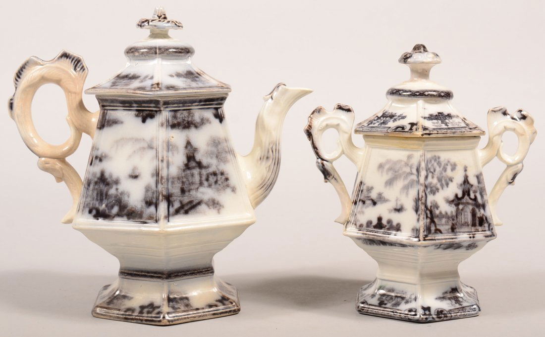 Two Pieces of Mulberry Transfer "Scinde" Pattern: Two Pieces of Mulberry Transfer "Scinde" Pattern Ironstone China. Paneled form with cock's comb handles. Teapot, 10"h. and covered sugar bowl, 8-1/2"h. Condition: Teapot has a chip on spout, sugar has