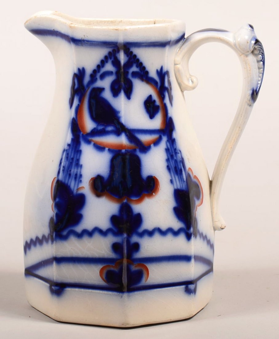 Gaudy Ironstone Flow Blue "Canary" Pattern Paneled Milk: Gaudy Ironstone Flow Blue "Canary" Pattern Paneled Milk Pitcher. Seldom found Design on a desirable form. 7-1/4"h. Condition: Very good.