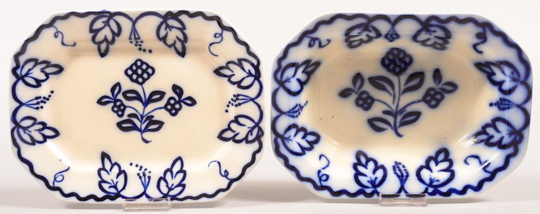 Two Pieces of Flow Blue Brush Stroke "Flowers, Leaves: Two Pieces of Flow Blue Brush Stroke "Flowers, Leaves and Berries" Pattern Ironstone China. 10-1/2" open vegetable bowl and 10-3/4" platter. Condition: Both are good, no damage.