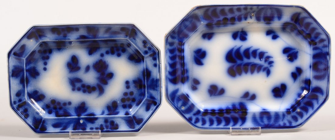 Two Flow Blue Brush Stroke Ironstone China Platters.: Two Flow Blue Brush Stroke Ironstone China Platters. "Fern and Tulip" 10-3/4"w. and "Astor and Grapeshot", 9-7/8"w. Condition: Larger is good, smaller has a 2" hairline crack.